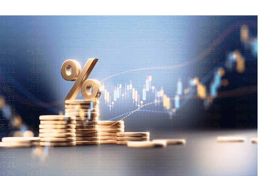 A golden percentage symbol on stacked coins with financial charts in the background.